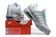 Nike Air Max 95 TT sneakers in white, grey, and green displayed with a shoe box labeled size 10