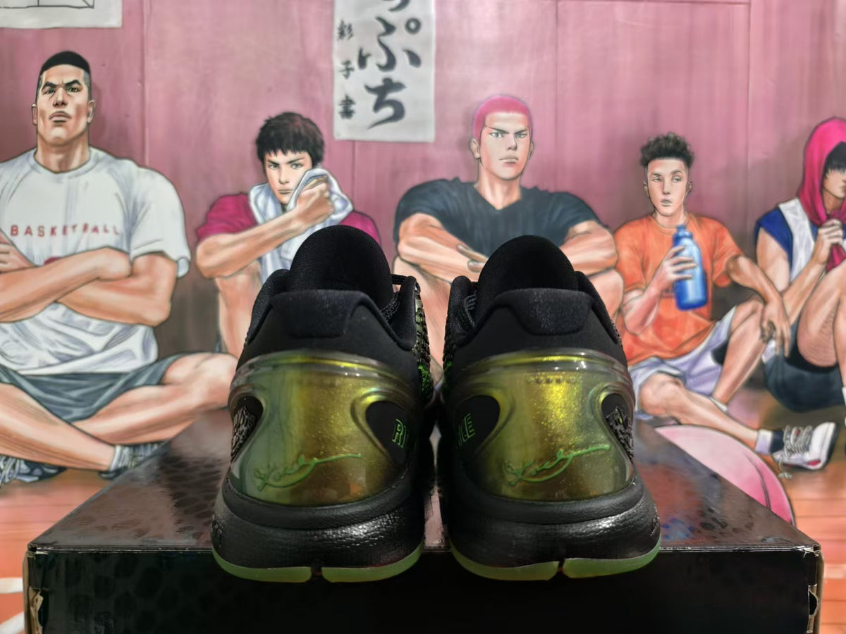 Rear view of black and green Nike basketball sneakers with translucent heel details