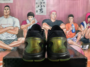 Rear view of black and green Nike basketball sneakers with translucent heel details