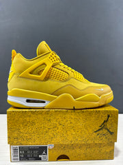 Side view of the yellow sneaker with the shoebox label visible, including Air Jordan 4 Retro, HF4340-008, and EU 42 sample sizing.