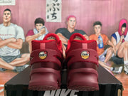 Rear view of red Nike Air Max Dn sneakers showing the Air Max heel badges and sculpted soles.