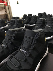 Front and upper close-up of a black high-top sneaker with layered lacing and a white midsole.