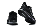 Black Nike running shoes viewed from the heel and outsole.