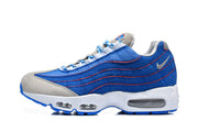 Side view of a blue and grey Nike Air Max 95 TT sneaker with red stitching and visible Air units.