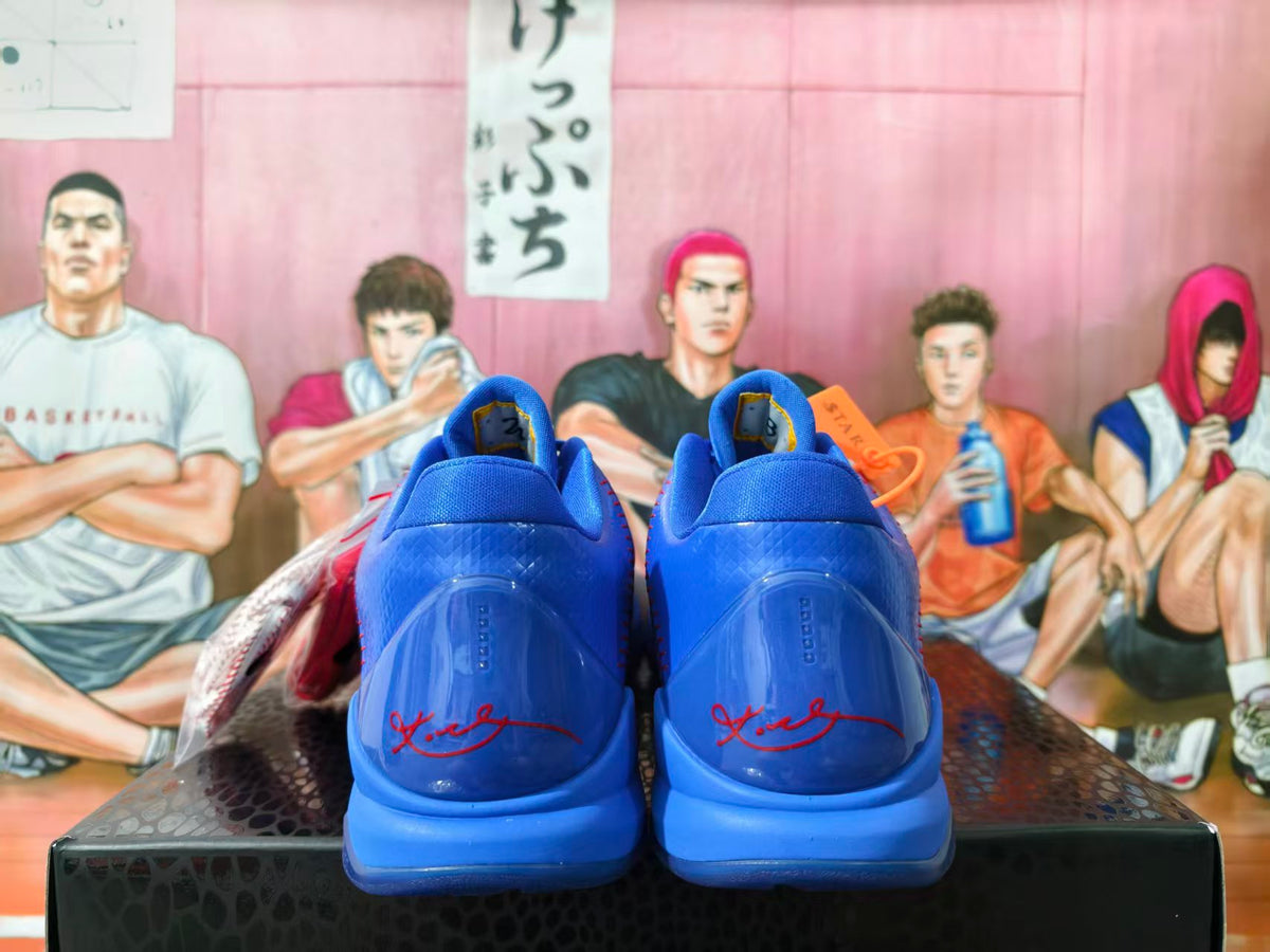Rear view of blue Nike Kobe basketball shoes showing signature heel details.