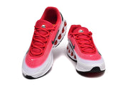 Front views of red and white Nike Air Max sneakers
