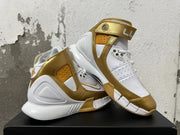Angled view showing the high-top ankle strap, perforated panels, and segmented outsole.