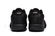 Rear view of the black sneakers showing padded collars, heel panels and textured outsole edges.