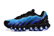 Side view of a blue and black Air Max DN sneaker with visible rounded sole cushioning.