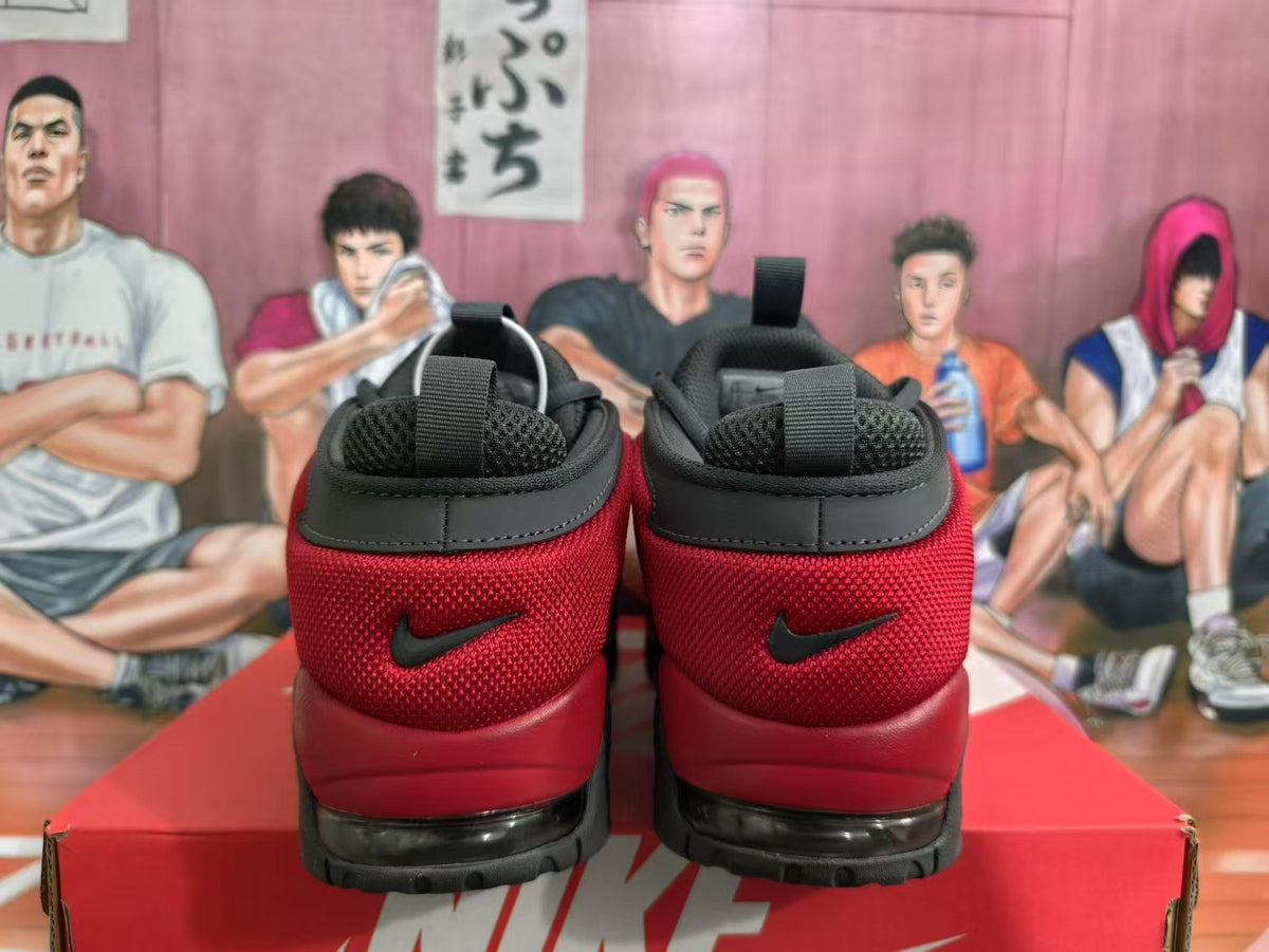 Rear view of red and black Nike sneakers with padded collars, black heel overlays, and rugged outsoles.