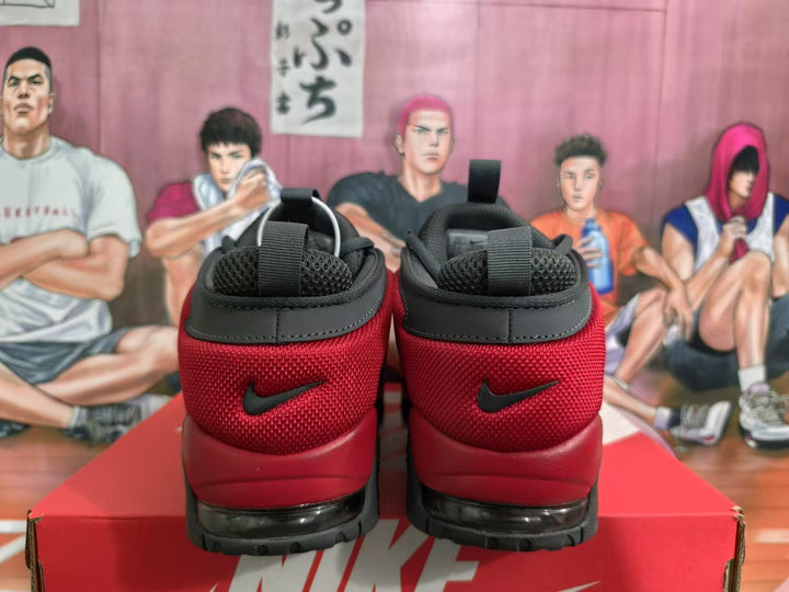 Rear view of red and black Nike sneakers with padded collars, black heel overlays, and rugged outsoles.