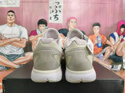 Rear view of the pair showing the sculpted heel panels and white midsoles.