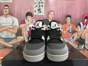 Front view showing black laces, mesh panels, white lace supports and grey toe overlays.