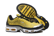 Nike Air Max Plus sneakers shown from the side and outsole, with black and yellow tread.