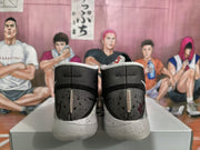 Rear view of the pair showing black perforated heel panels, speckled midsoles, and translucent outsoles.