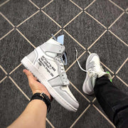 Side view showing printed text on the outer panel, grey overlays and the white midsole.