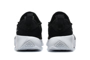 Rear view of the black and white Nike LeBron sneakers.