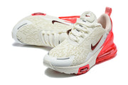 Pair of white and red Nike Air Max 270 Premium sneakers viewed from above