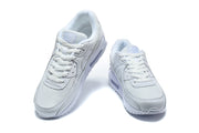 Pair of white Nike Air Max 90 sneakers viewed from the front.