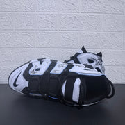 Nike Air More Uptempo sneakers shown from above in black and white with panda graphics.