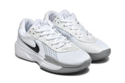 Angled view showing the white upper, black Swoosh details, and grey accents.
