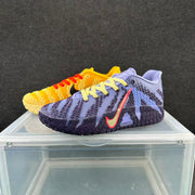 Lavender and navy shoe in front of a golden yellow and cream shoe