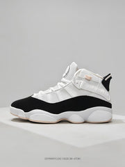 Side profile of the white and black high-top sneaker with a padded collar and layered upper panels.