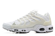 Side view of a white Nike Air Max Terrascape Plus sneaker with pale cream overlays and a speckled midsole.