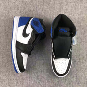 Top view of a pair showing the black padded collars, blue ankle accents, perforated white toe boxes, and black-and-white panels.
