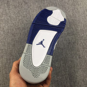 View of the outsole showing blue, white, and gray sections with patterned traction.