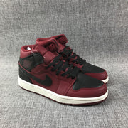 Pair of burgundy and black high-top sneakers shown from a front three-quarter angle.