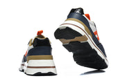 Rear and outsole views of navy, white, and tan Hermès sneakers.
