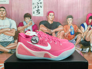 Pink Nike Kobe basketball shoes shown from the outer side