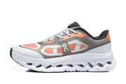Side profile of a gray and orange On Cloudswift Remix shoe.