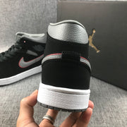 Close-up of the heel showing the grey padded collar, black heel and layered outsole.