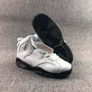 Angled view showing the white sneaker uppers, black outsoles, and heel cushioning windows.