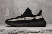 Side profile highlighting the light stripe, SPLY-350 lettering and black ribbed sole.