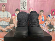 Front view showing the black textured uppers, laces, padded tongues, and rounded toe sections.