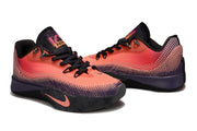 Coral and purple Nike S.T. Flare EP sneakers shown together from a side angle.
