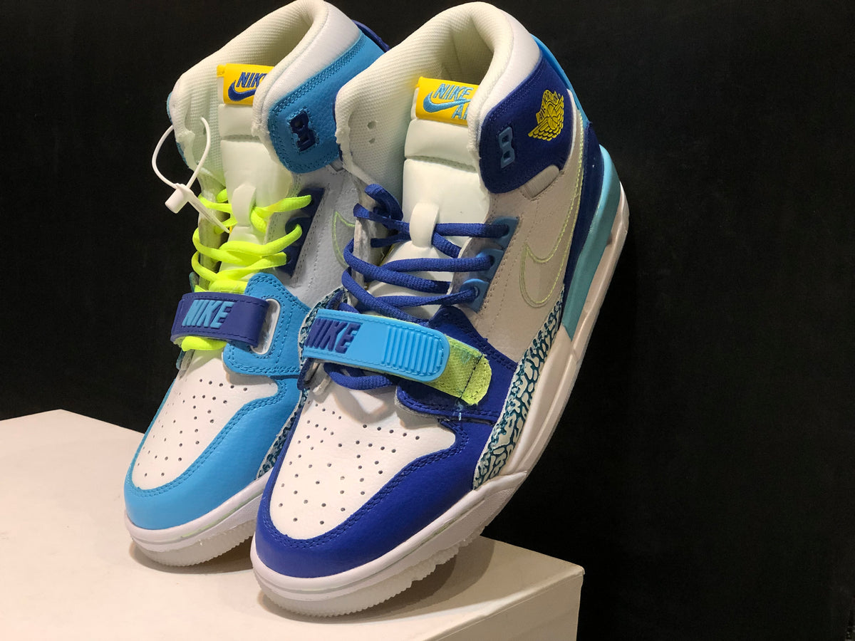 Pair of mismatched blue and white high-top sneakers shown from a front three-quarter angle.