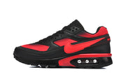 Side profile of a black and red Nike Air Max sneaker with a visible heel Air unit.