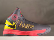 Opposite side view showing the yellow Swoosh, patterned ankle panel, and red midsole
