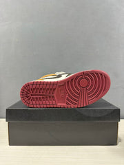 Bottom view showing the burgundy rubber outsole with circular traction and patterned tread.