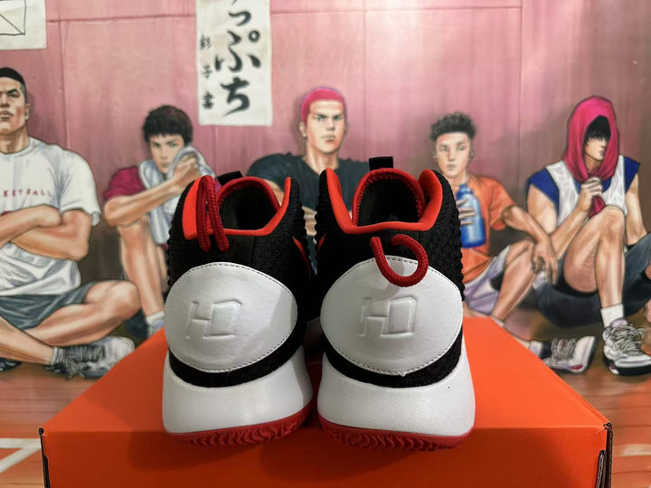 Rear view of black, white, and red Nike basketball shoes.