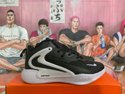 Side view showing the black upper, large white Swoosh detail, white midsole, and visible Zoom marking.