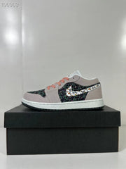 Side profile of the low-top sneaker displayed on a black shoe box.