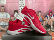 Angled side view showing the red upper, white Swoosh, white midsole, and red outsole accents.