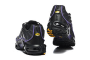 Rear views of black Nike Air Max Plus sneakers with purple trim and sculpted soles