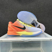 Pair of gradient basketball sneakers showing the textured uppers, black side branding, yellow laces, and translucent outsoles.