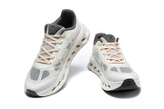 Front and top views of the white and gray On Cloudtilt Remix sneakers.
